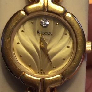 Gold bulova watch diamond face